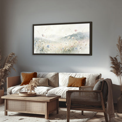 Watercolor wildflower meadow painting framed canvas wall art in a rustic living room