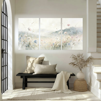 Watercolor wildflower meadow painting set of 3 poster prints in an entryway above a bench