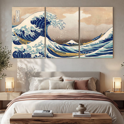 The Great Wave Japanese style painting 3 piece canvas wall art in a bedroom above the bed