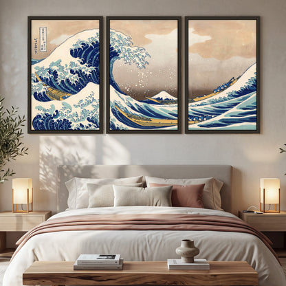 The Great Wave Japanese style painting 3 piece framed canvas in a bedroom above the bed