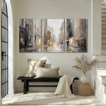 Rainy city street painting 3 piece canvas wall art in an entryway above a bench