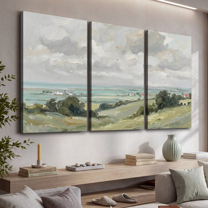 Coastal Countryside 3 piece canvas wall art set hanging in a modern living room above a console shelf