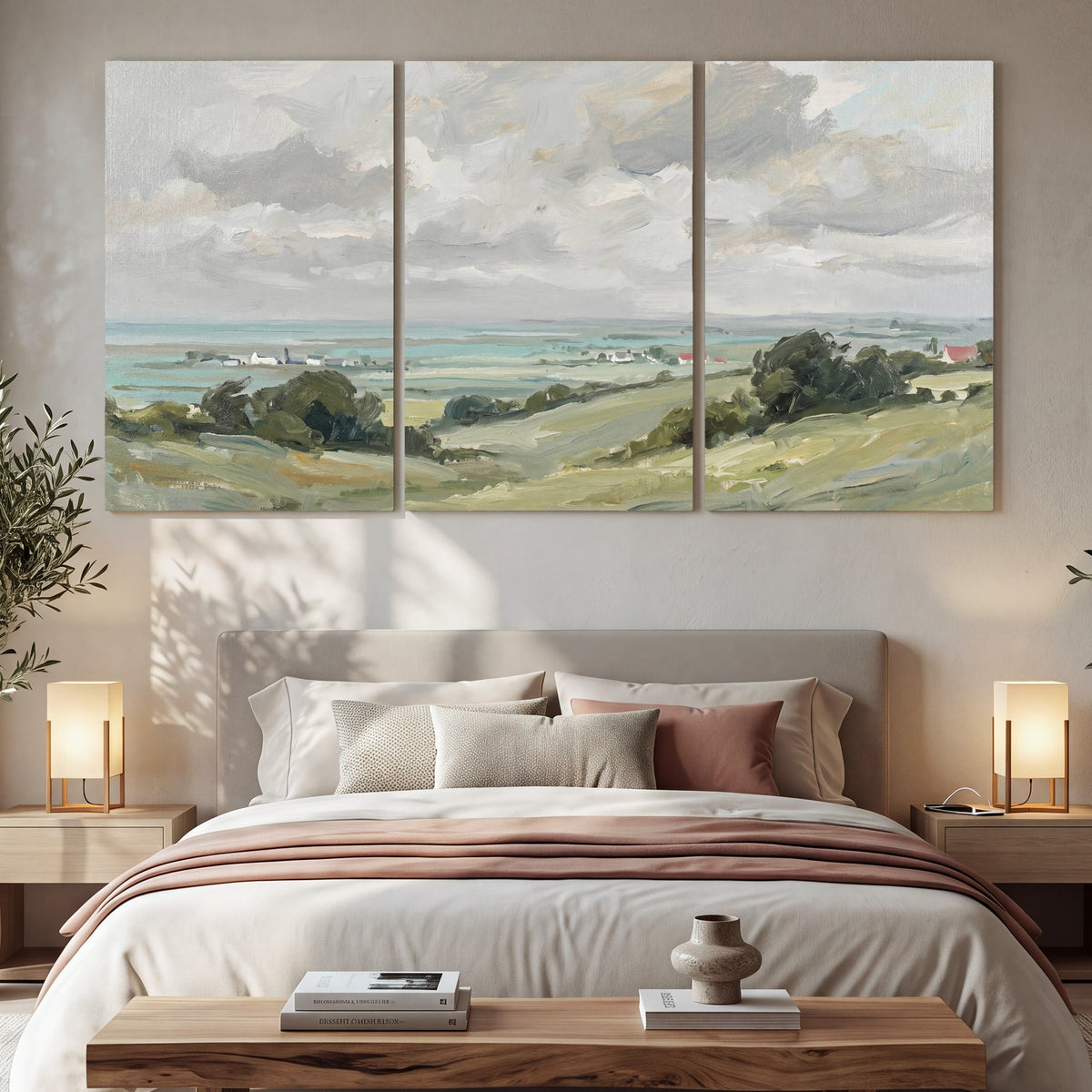 Coastal Countryside 3 piece canvas wall art set hanging in a bedroom above the bed