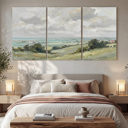 Coastal Countryside 3 piece canvas wall art set hanging in a bedroom above the bed