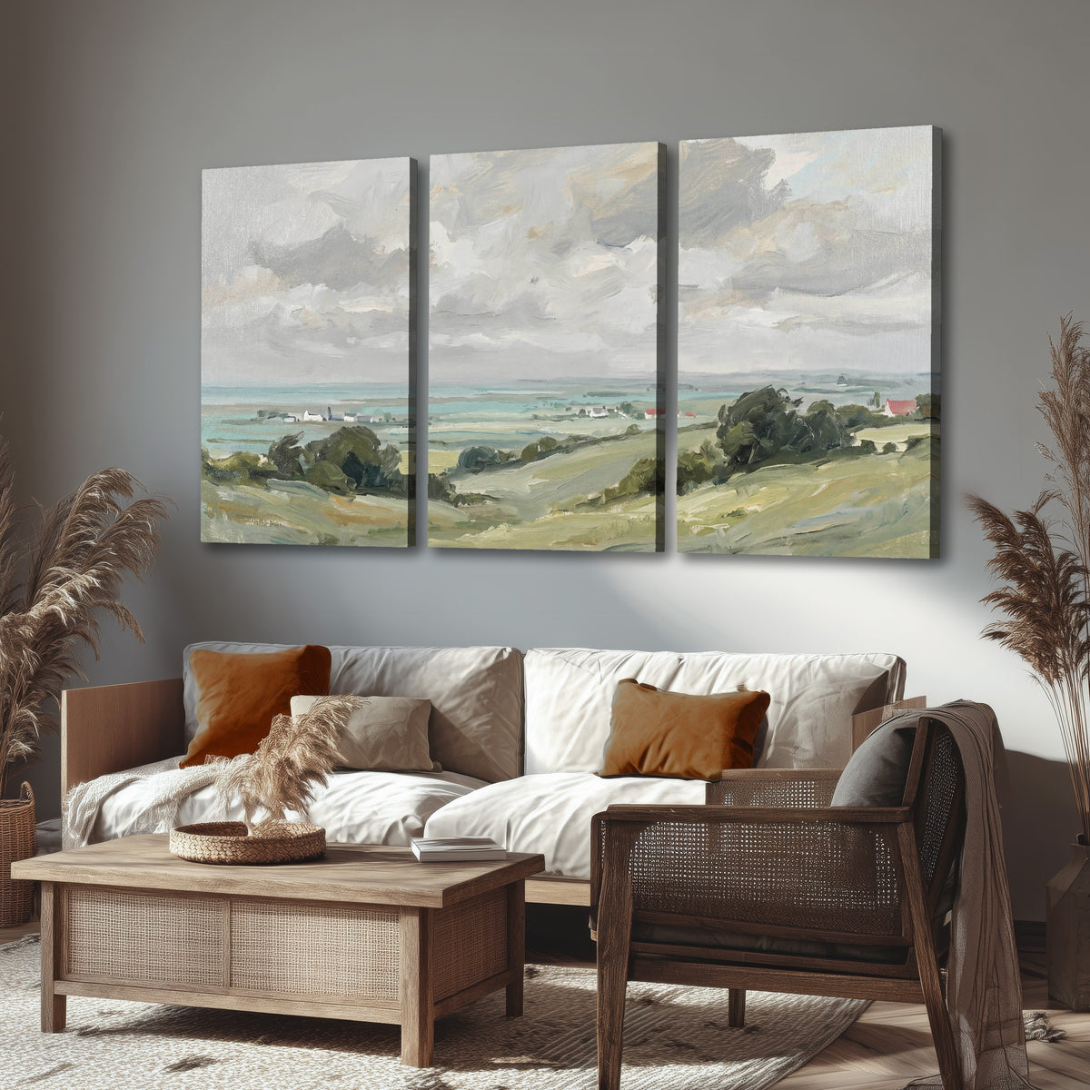 Coastal Countryside 3 piece canvas wall art set hanging in a boho living room above a sofa