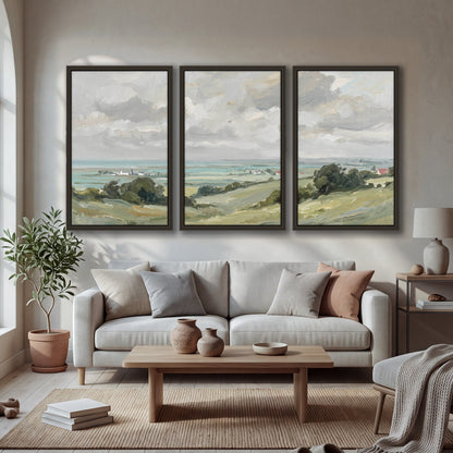 Coastal Countryside 3 piece framed canvas wall art hanging in a bright living room