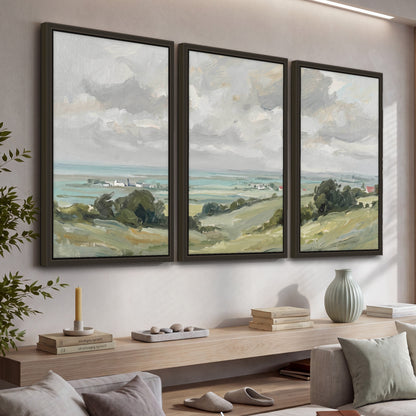 Coastal Countryside 3 piece framed canvas wall art hanging in a living room with a long console