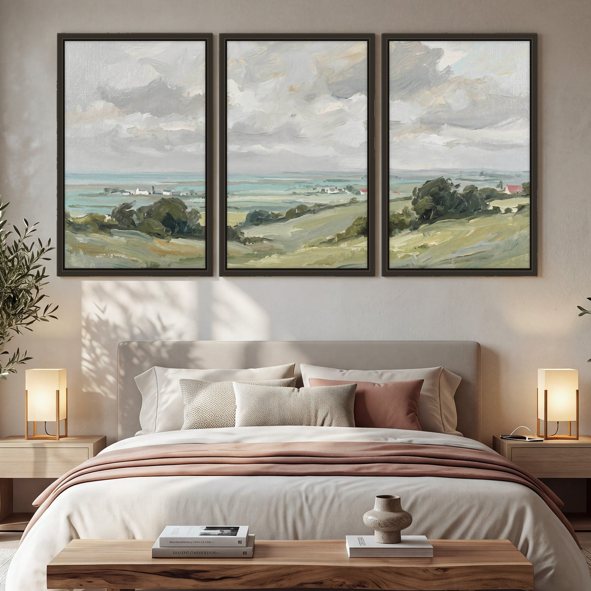 Coastal Countryside 3 piece framed canvas wall art hanging in a cozy bedroom