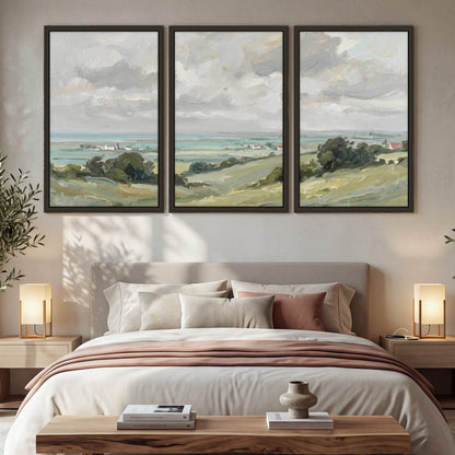 Coastal Countryside 3 piece framed canvas wall art hanging in a cozy bedroom