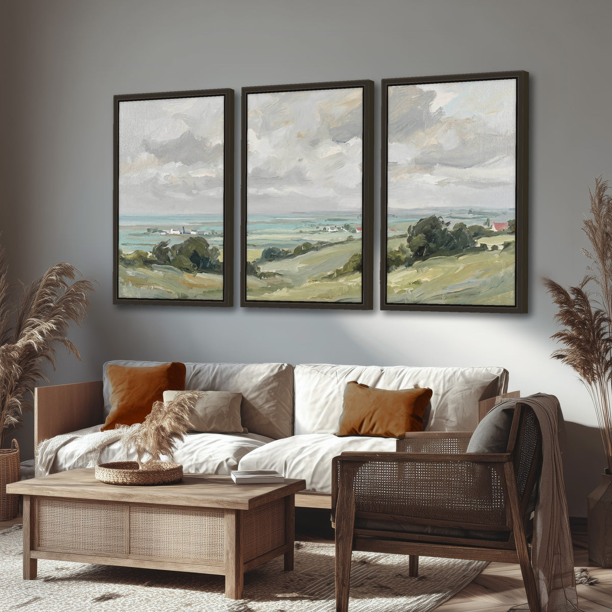 Coastal Countryside 3 piece framed canvas wall art hanging in a rustic living room