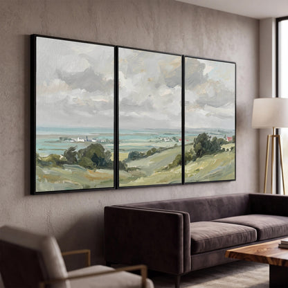 Coastal Countryside 3 piece framed canvas wall art hanging in a modern living room