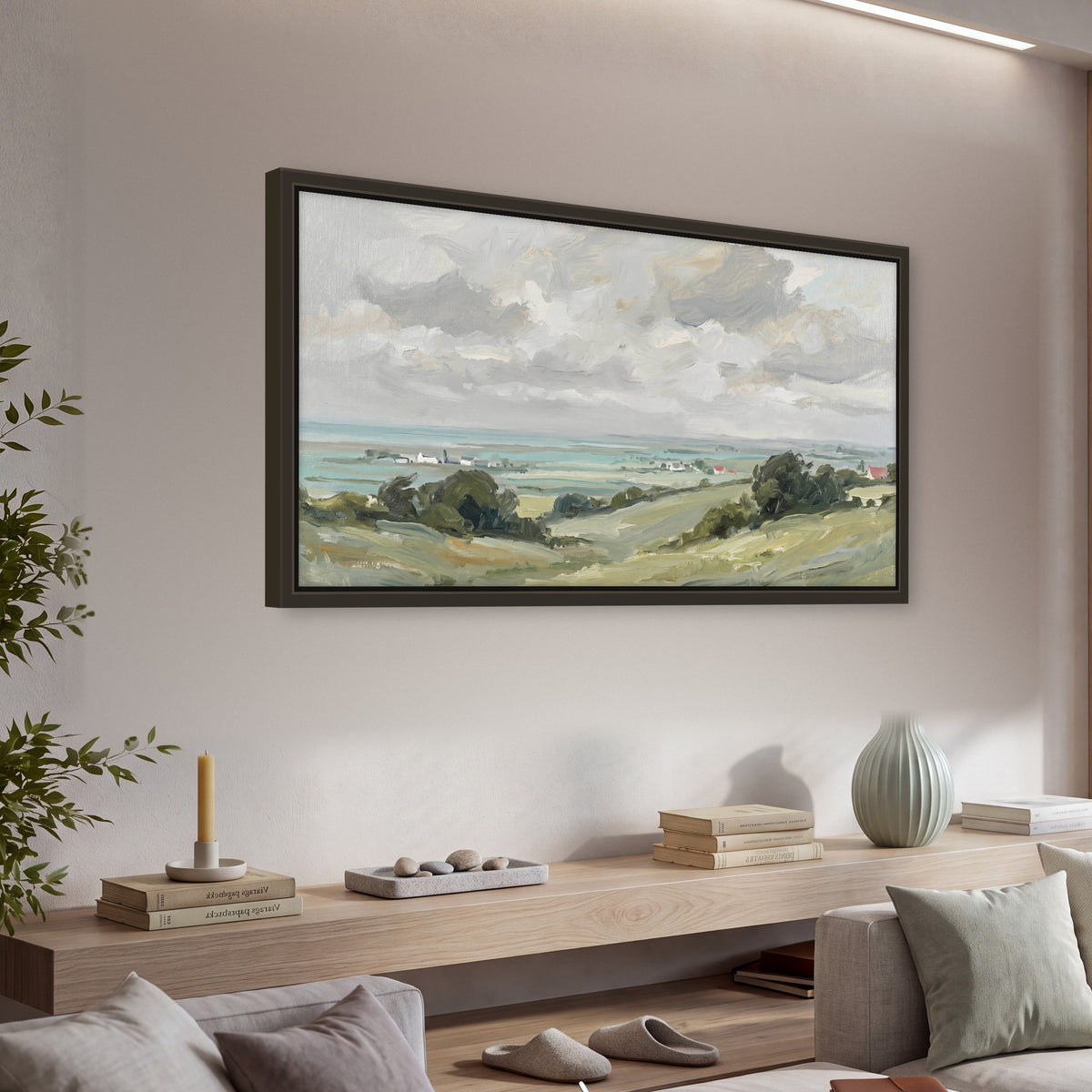 Coastal Countryside framed canvas wall art, single panoramic piece hanging in a living room with a long console