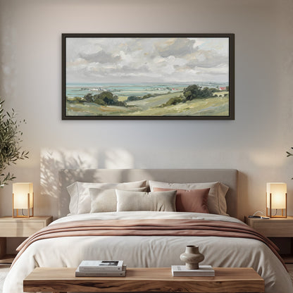 Coastal Countryside framed canvas wall art, single panoramic piece hanging in a cozy bedroom