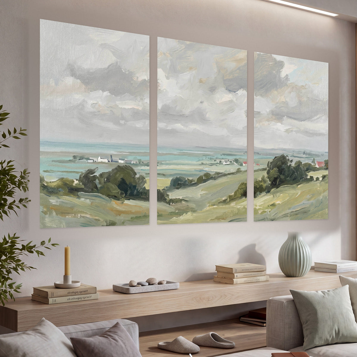 Coastal Countryside set of 3 poster prints hanging in a living room with a long console