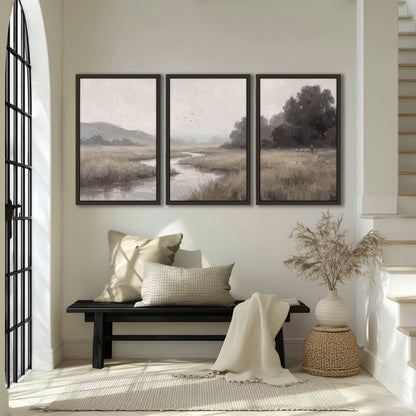 Misty meadow stream painting 3 piece framed canvas in an entryway above a bench