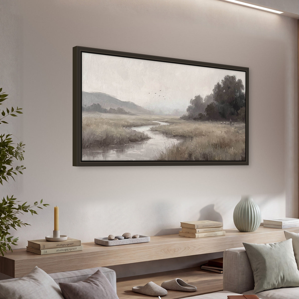 Misty meadow stream painting framed canvas wall art in a living room above a console