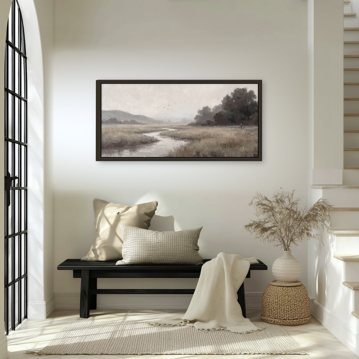 Misty meadow stream painting framed canvas wall art in an entryway above a bench