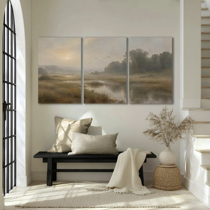 Golden marsh sunrise painting 3 piece canvas wall art in an entryway above a bench