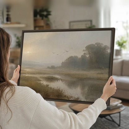 Golden marsh sunrise painting framed canvas held in hands