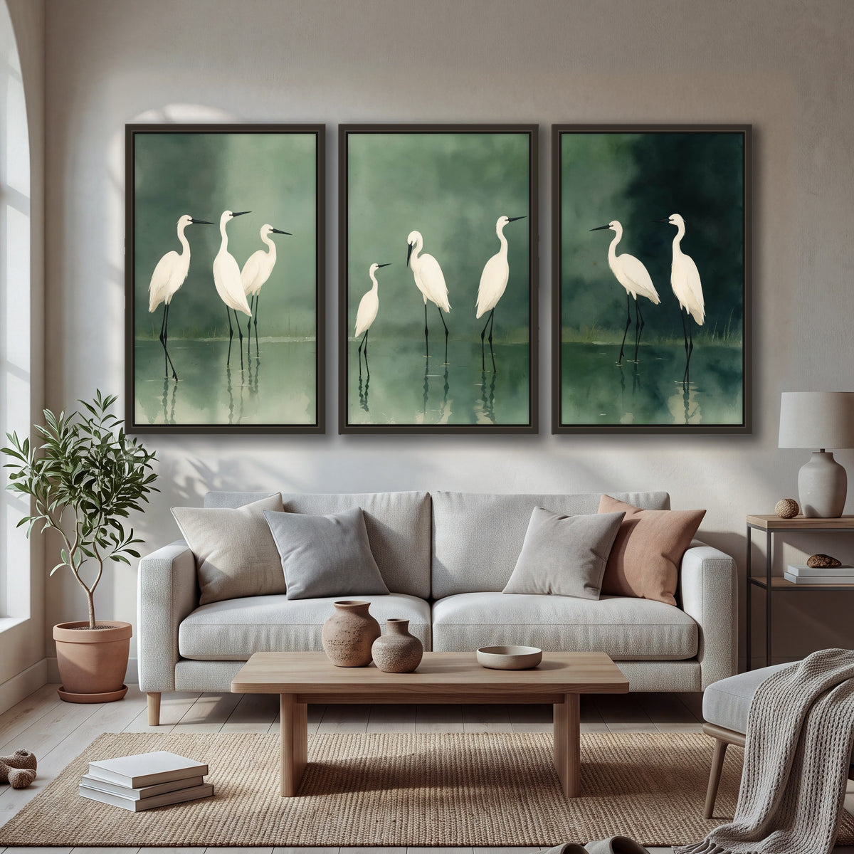 White egrets on green lake painting 3 piece framed canvas in a bright living room