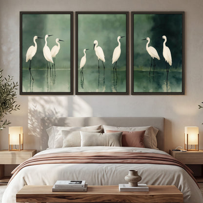 White egrets on green lake painting 3 piece framed canvas in a bedroom above the bed