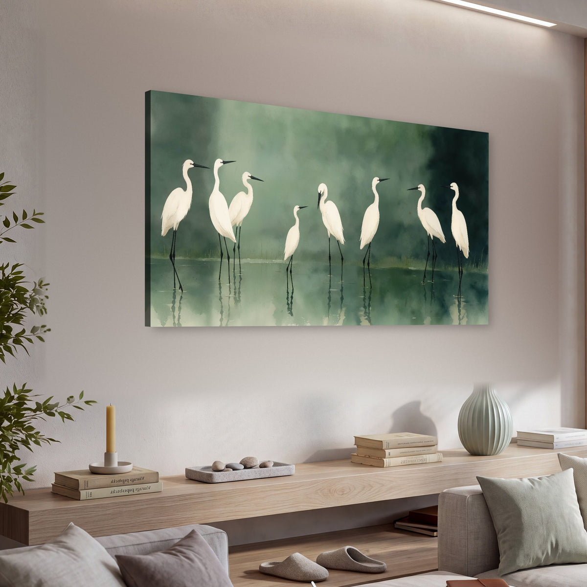White egrets on green lake painting canvas wall art in a living room above a console