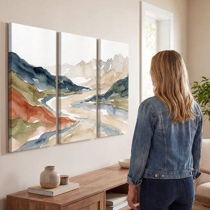 Watercolor mountain valley painting 3 piece canvas wall art in a living room