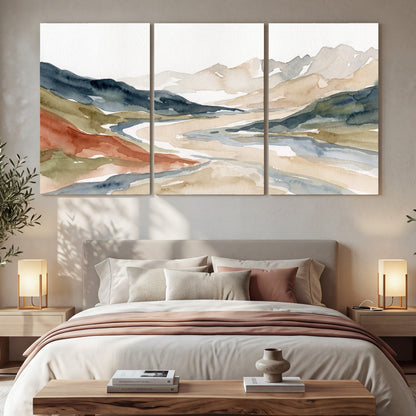 Watercolor mountain valley painting 3 piece canvas wall art in a bedroom above the bed