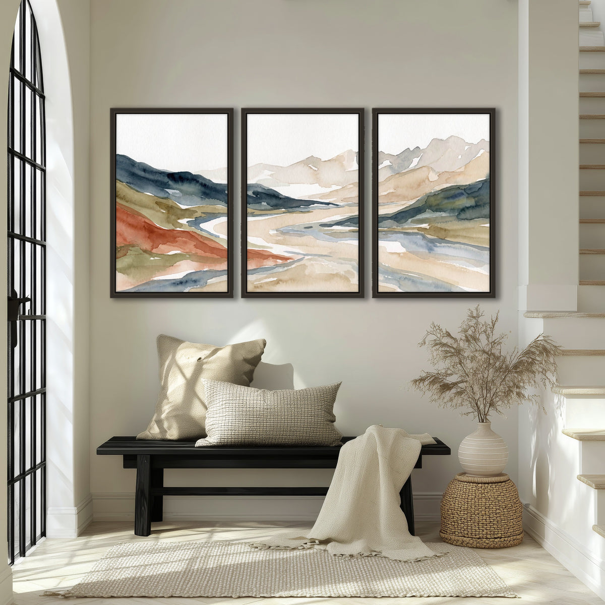 Watercolor mountain valley painting 3 piece framed canvas in an entryway above a bench
