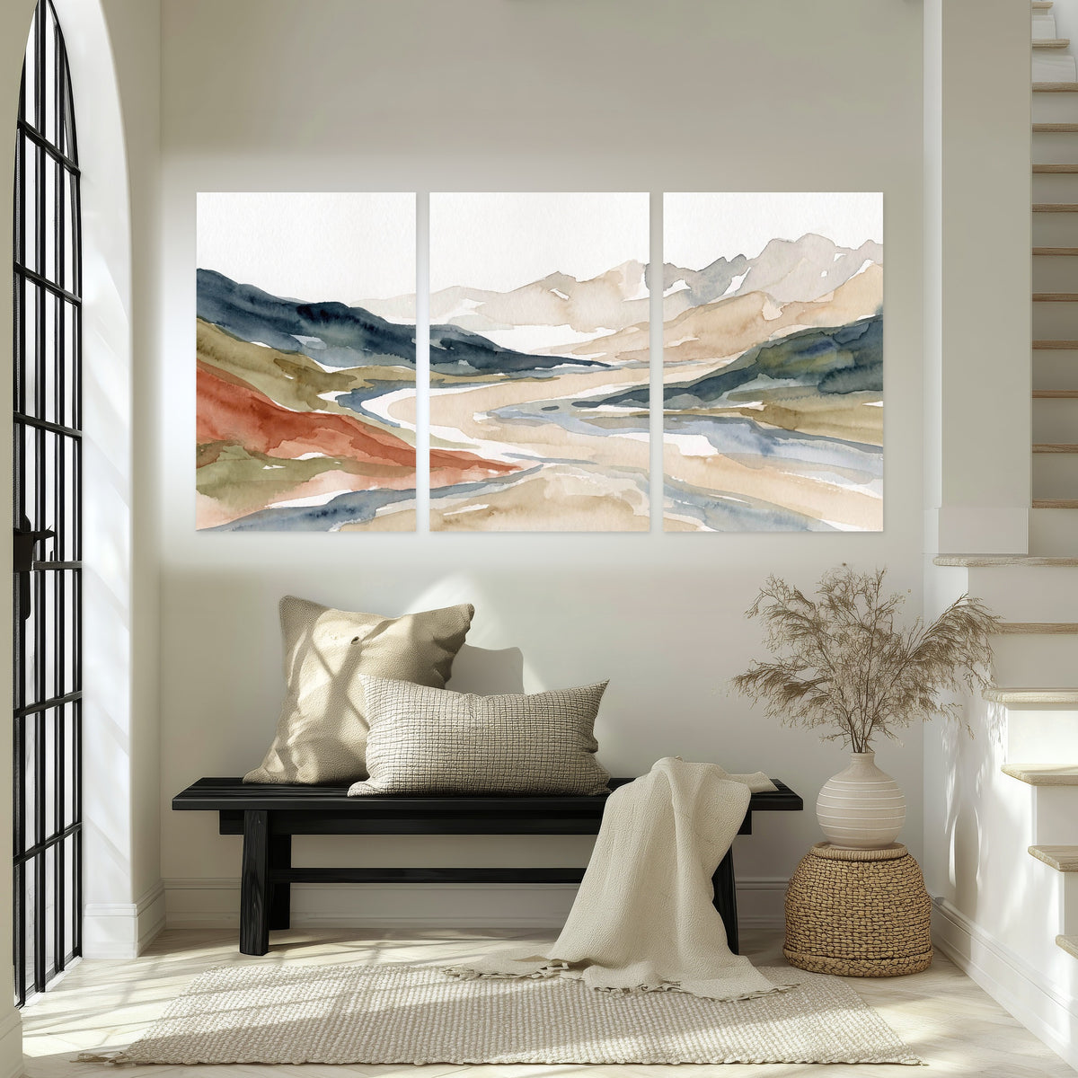Watercolor mountain valley painting set of 3 poster prints in an entryway above a bench