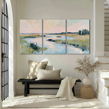Pastel marsh river painting 3 piece canvas wall art in an entryway above a bench