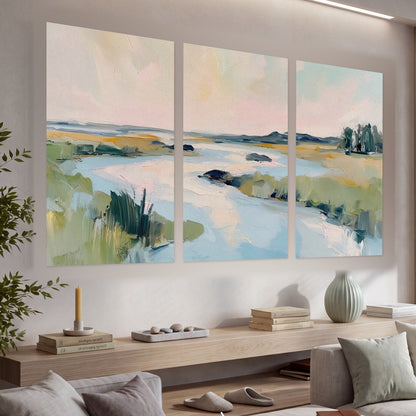 Pastel marsh river painting set of 3 poster prints in a living room above a console