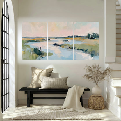 Pastel marsh river painting set of 3 poster prints in an entryway above a bench