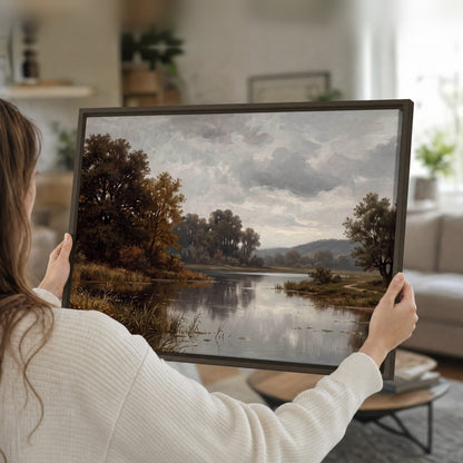 Autumn river landscape painting framed canvas held in hands