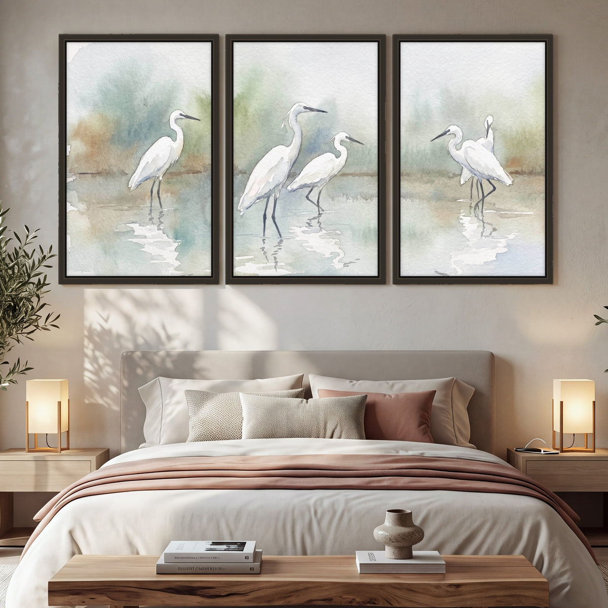 White egrets watercolor 3 piece framed canvas in a bedroom above the bed
