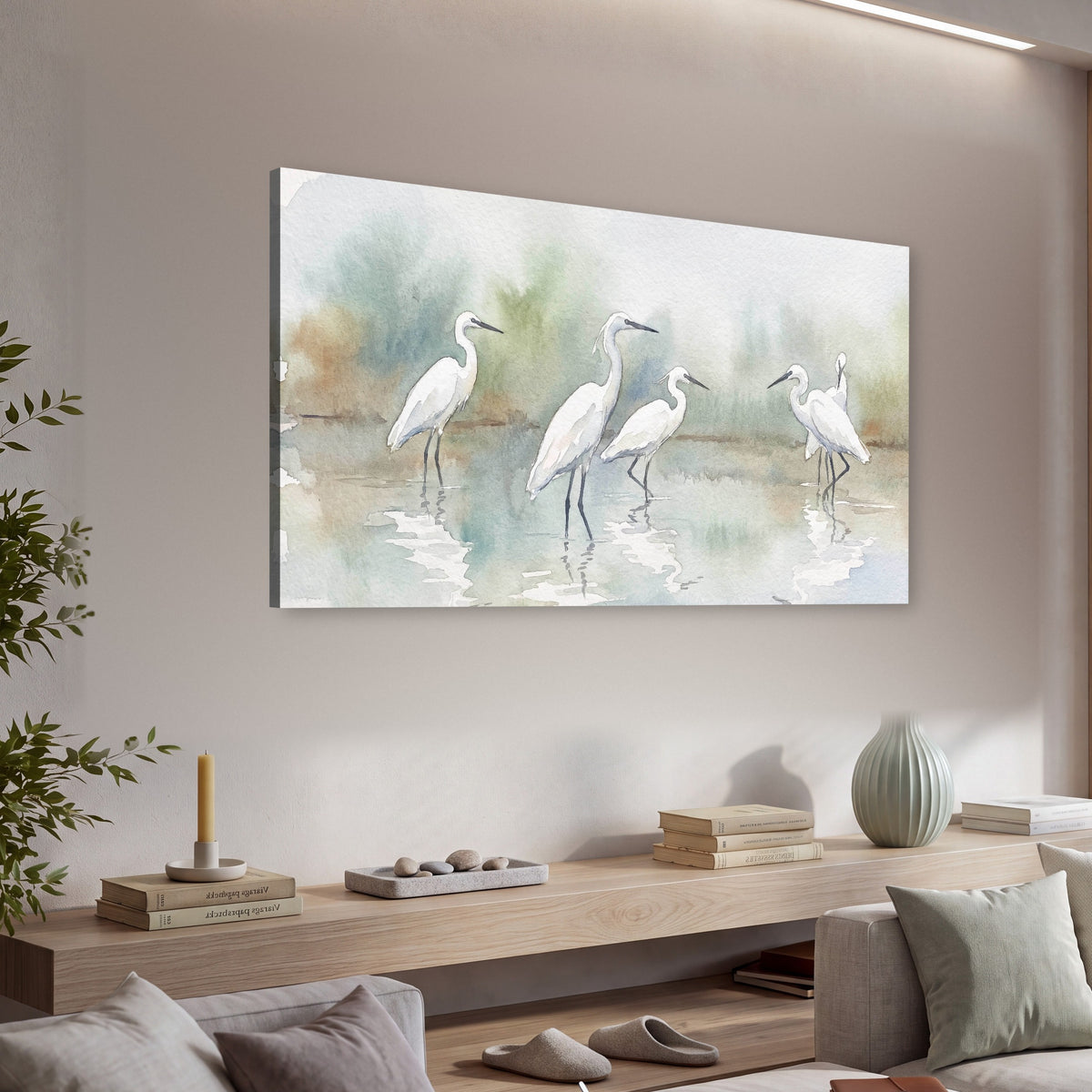 White egrets watercolor canvas wall art in a living room above a console