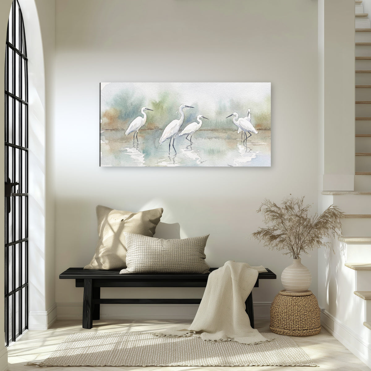 White egrets watercolor canvas wall art in an entryway above a bench