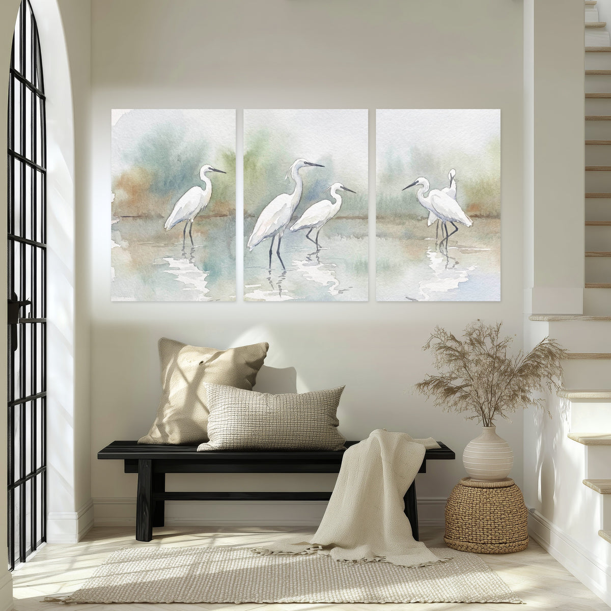White egrets watercolor set of 3 poster prints in an entryway above a bench