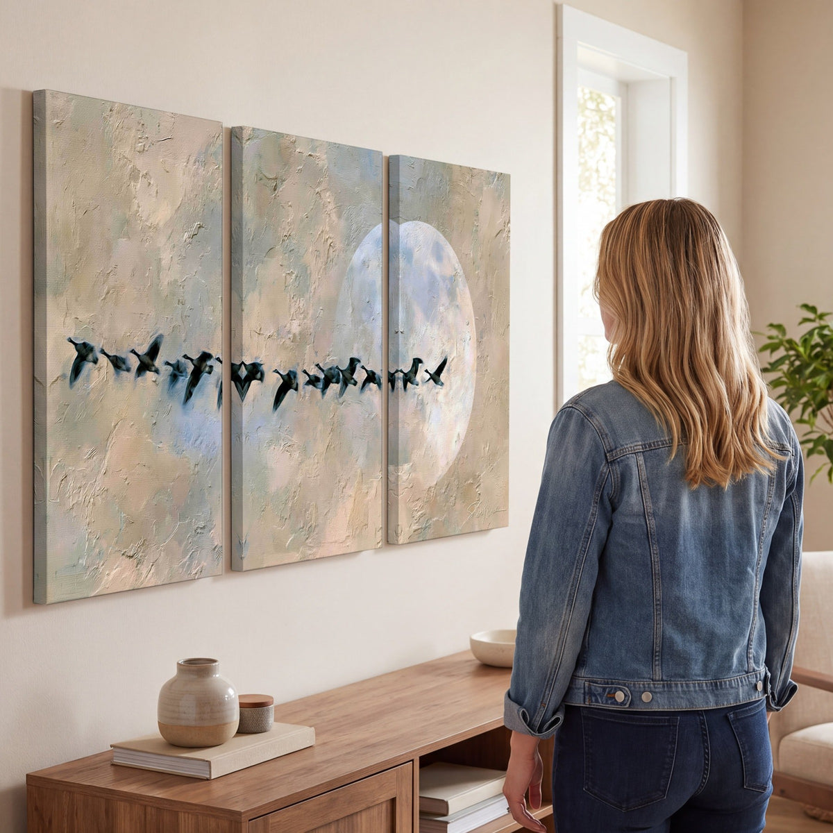 Geese flying across the moon painting 3 piece canvas wall art in a living room