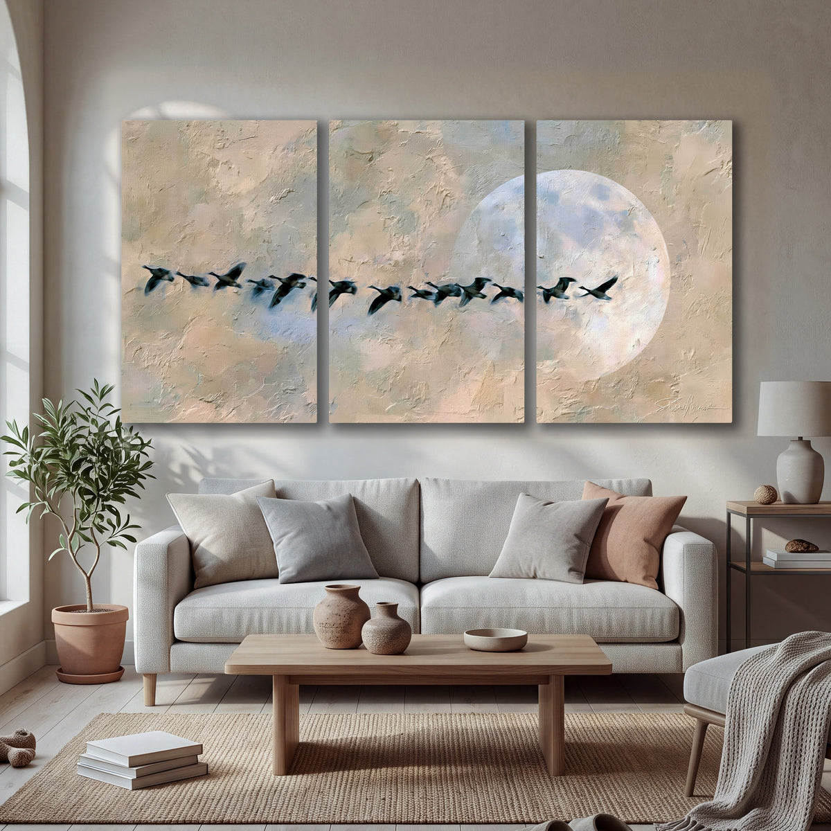 Geese flying across the moon painting 3 piece canvas wall art in a bright living room