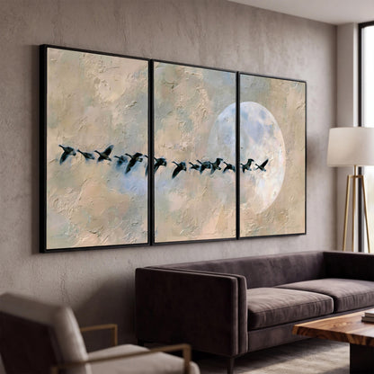 Geese flying across the moon painting 3 piece canvas wall art in a modern living room