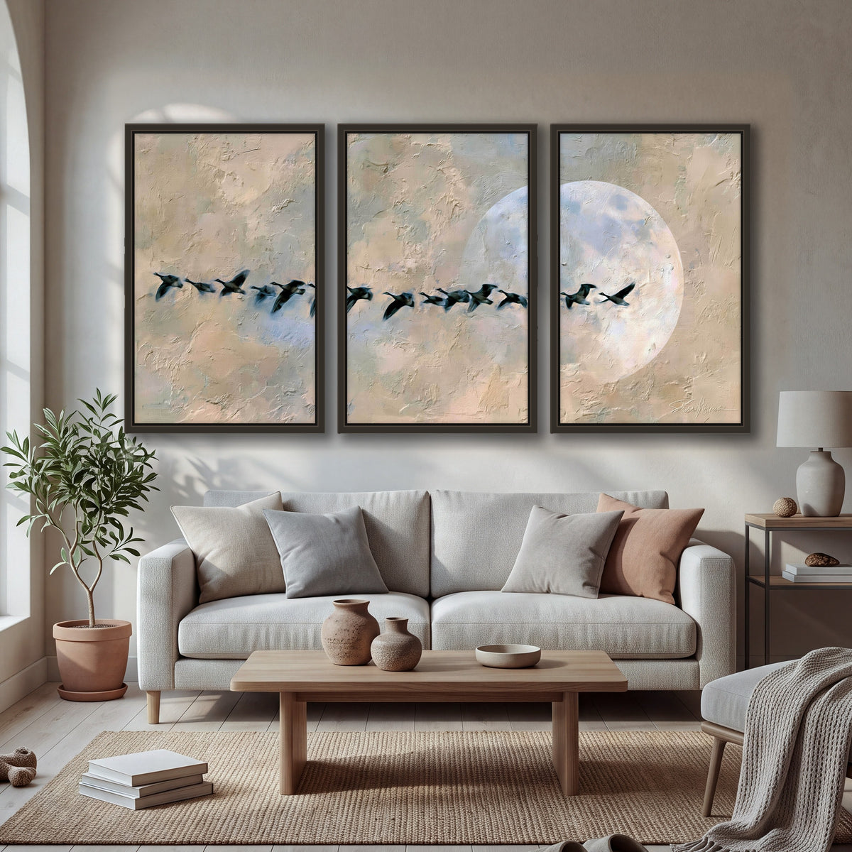 Geese flying across the moon painting 3 piece framed canvas in a bright living room