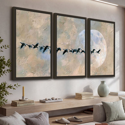 Geese flying across the moon painting 3 piece framed canvas in a living room above a console