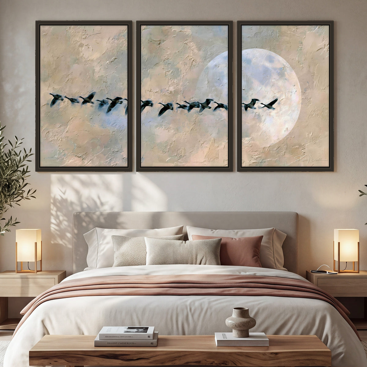 Geese flying across the moon painting 3 piece framed canvas in a bedroom above the bed