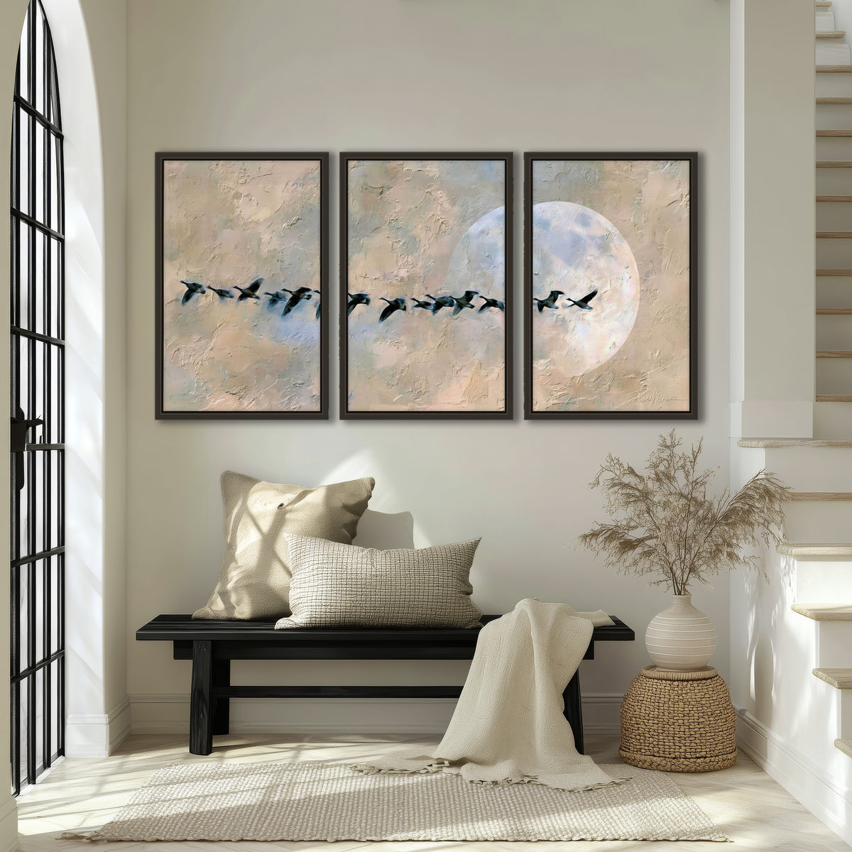 Geese flying across the moon painting 3 piece framed canvas in an entryway above a bench