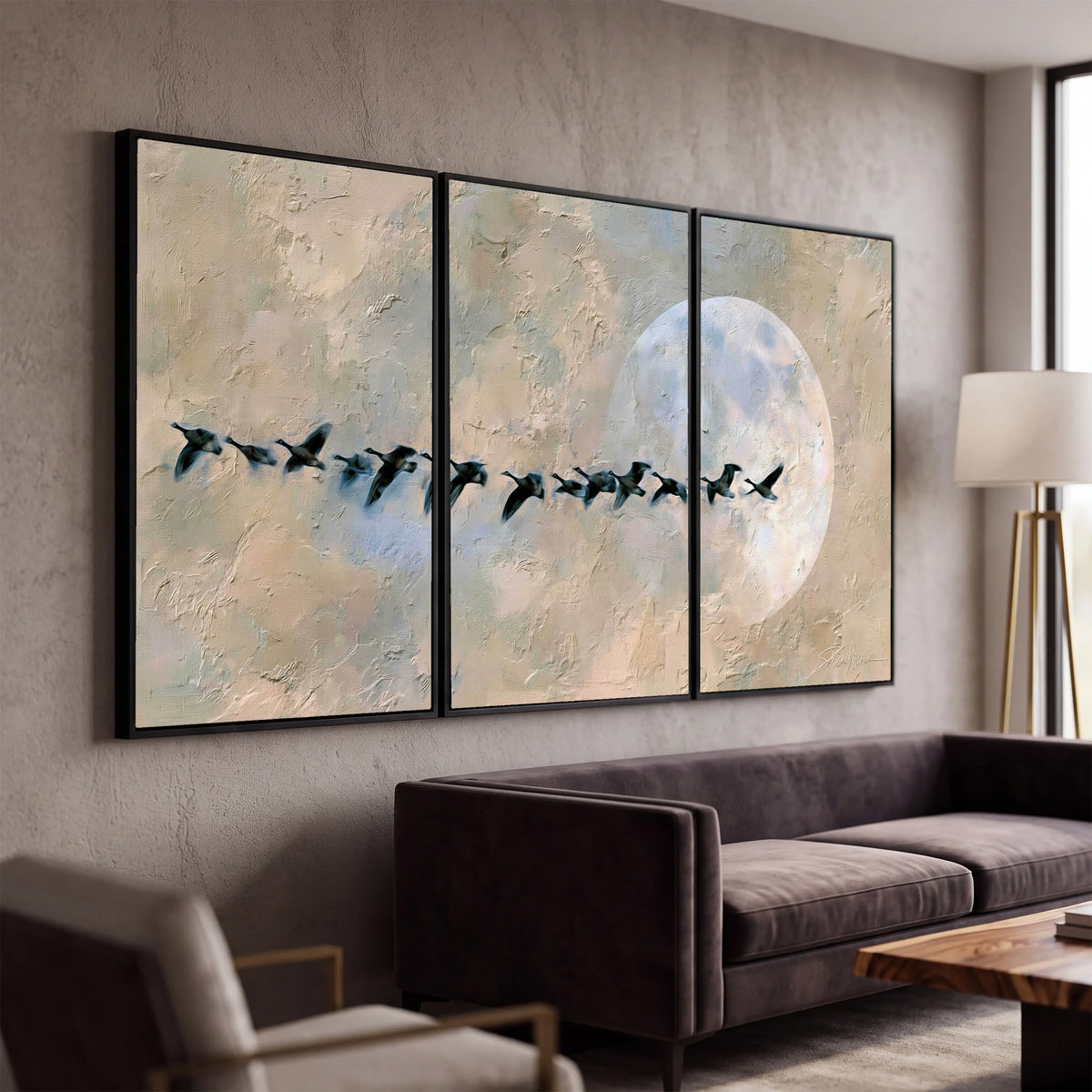 Geese flying across the moon painting 3 piece framed canvas in a modern living room