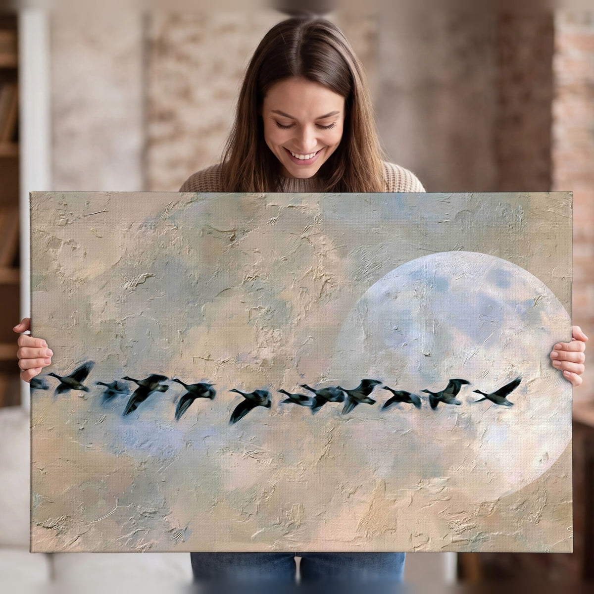 Geese flying across the moon painting canvas wall art held in hands