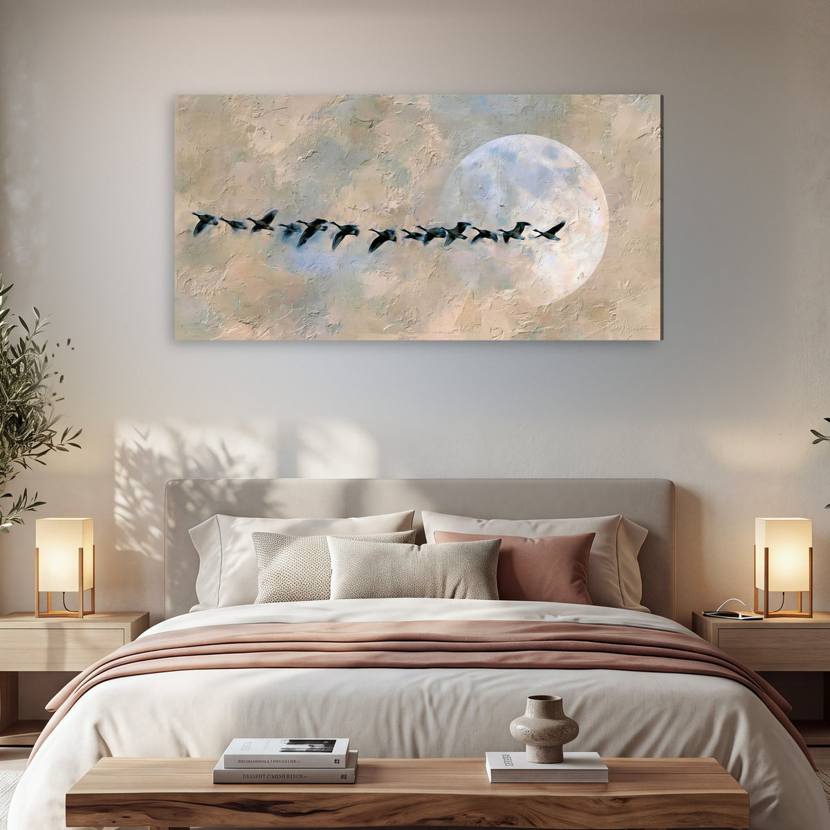Geese flying across the moon painting canvas wall art in a bedroom above the bed