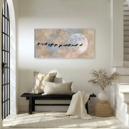 Geese flying across the moon painting canvas wall art in an entryway above a bench