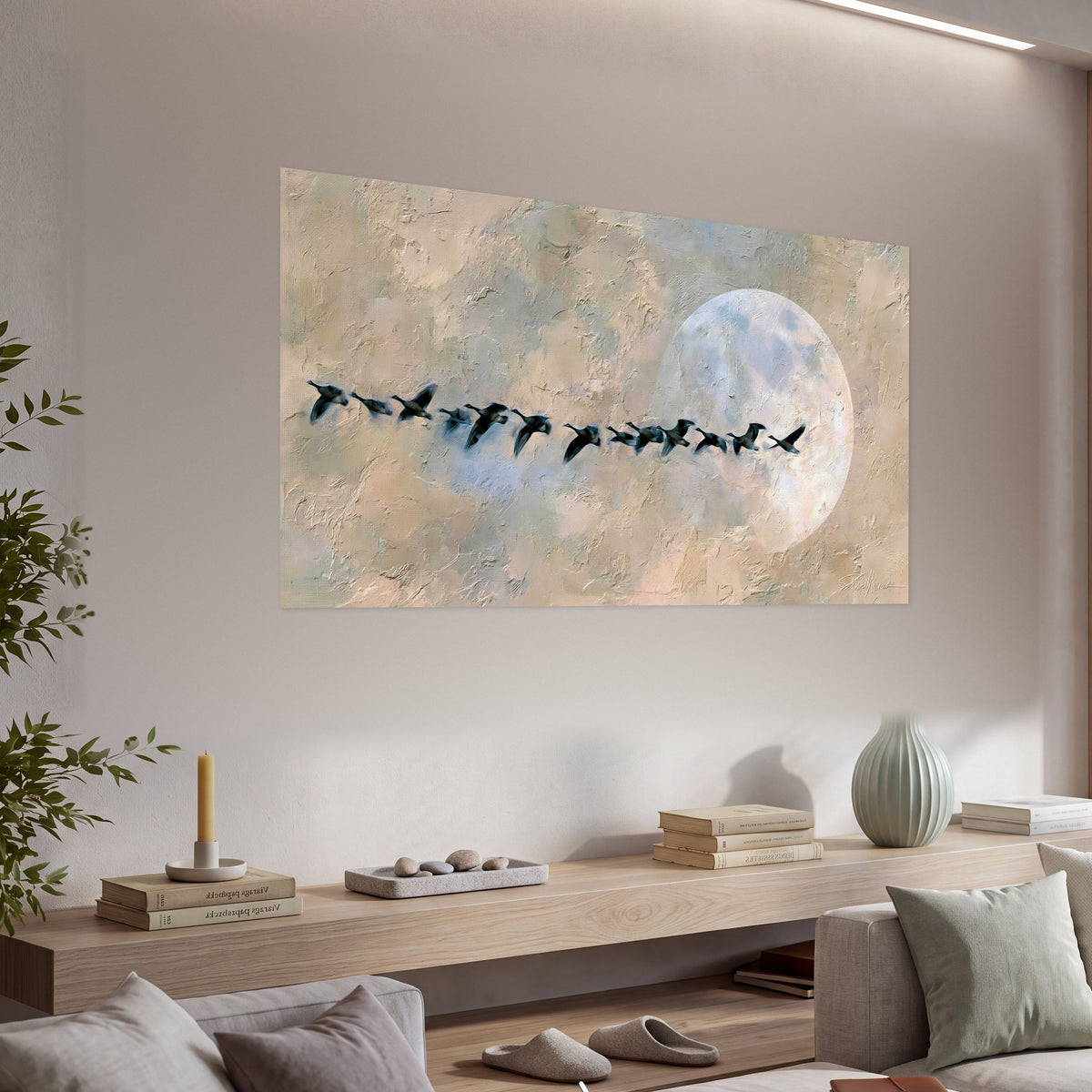 Geese flying across the moon painting poster print in a living room above a console